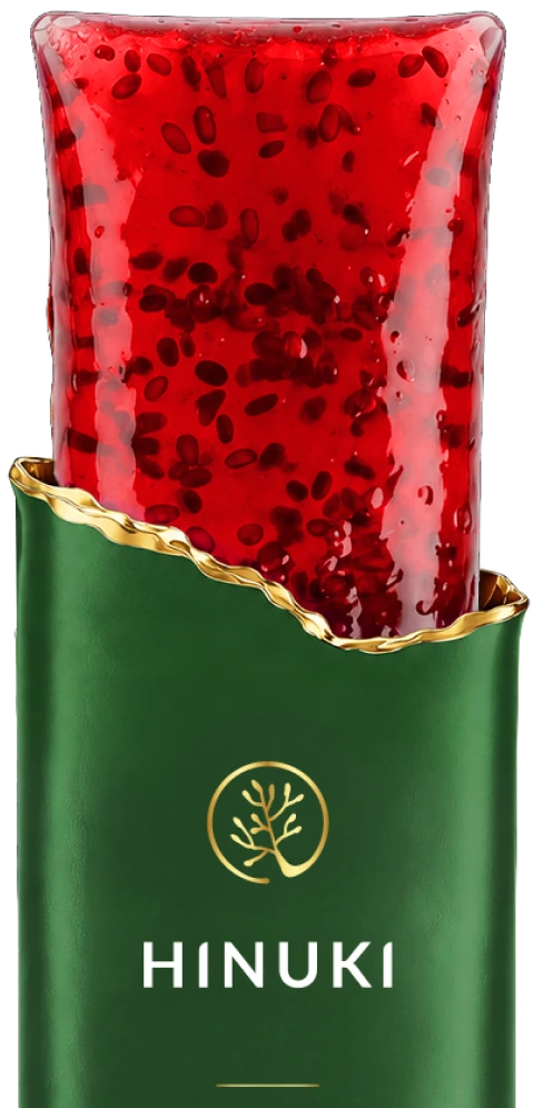 Close-up of a Hinuki jelly stick showing the red pomegranate jelly with chia seeds