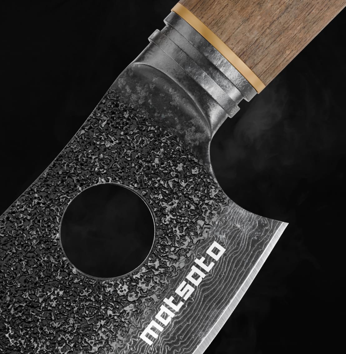 Close-up of the Matsato Osuren hammered blade with the index-finger hole and the matsato logo
