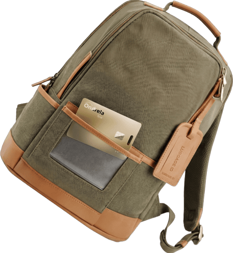 Ondrela tracker card being placed in the pocket of a backpack for travel and luggage tracking
