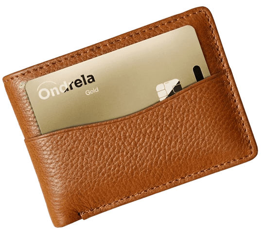 Gold Ondrela tracker card sliding into the card slot of a brown leather wallet
