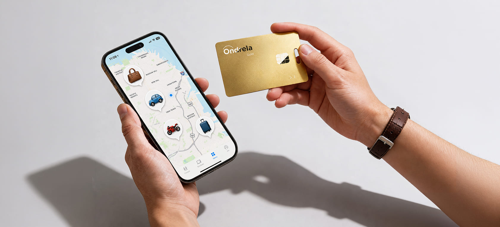 Ondrela review 2026: the gold Ondrela tracker card next to a smartphone that shows the card’s location on a map