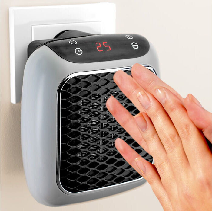 Hand bedient de aanraaktoetsen van de WellHeater-stopcontactkachel